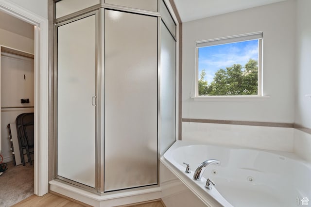 2711 N Deer Meadow Dr, Lehi, UT 84043 - bathroom with a shower stall, a whirlpool tub, a walk in closet, and wood finished floors