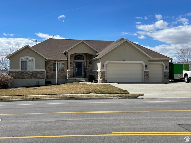 ranch-style home featuring driveway, stucco siding, stone siding, and a garage