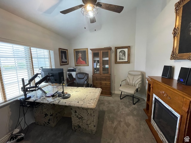 office space with carpet floors, baseboards, lofted ceiling, and ceiling fan