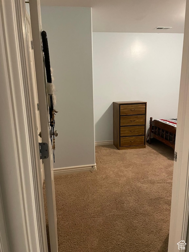 interior space featuring carpet floors and visible vents