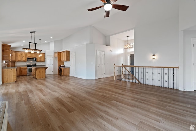 2711 N Deer Meadow Dr, Lehi, UT 84043 - unfurnished living room with ceiling fan, light wood-style flooring, high vaulted ceiling, recessed lighting, and baseboards