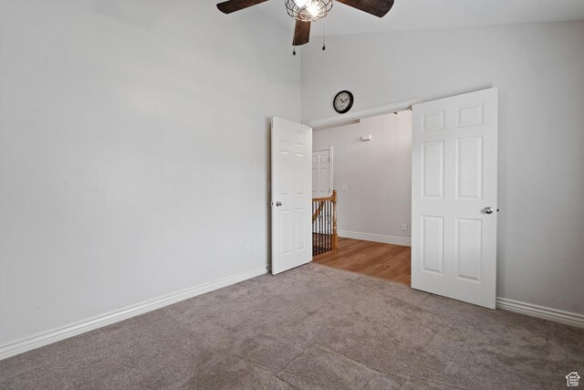 2711 N Deer Meadow Dr, Lehi, UT 84043 - unfurnished bedroom featuring carpet, baseboards, high vaulted ceiling, and a ceiling fan