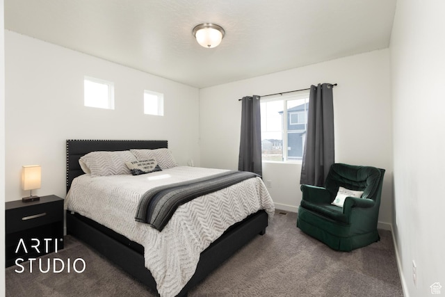 bedroom featuring carpet floors and baseboards