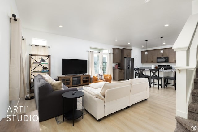 living room featuring recessed lighting and light wood-type flooring