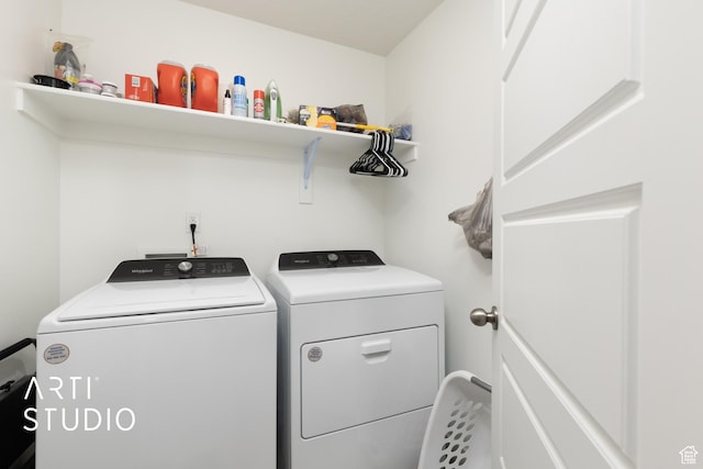 laundry area featuring separate washer and dryer and laundry area
