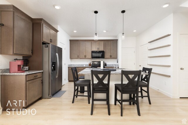 kitchen with recessed lighting, stainless steel appliances, and light wood-type flooring