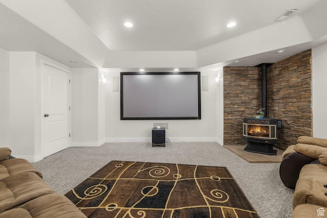 13053 S 1300 W, Riverton, UT 84065 - cinema with carpet flooring, a wood stove, baseboards, a raised ceiling, and recessed lighting