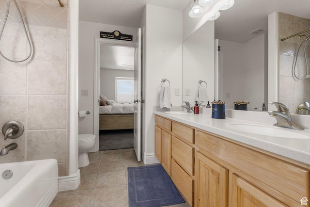 13053 S 1300 W, Riverton, UT 84065 - ensuite bathroom with double vanity, toilet, tile patterned flooring, and  shower combination