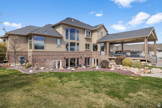 13053 S 1300 W, Riverton, UT 84065 - back of property featuring stucco siding, brick siding, and a lawn