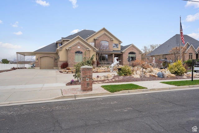 13053 S 1300 W, Riverton, UT 84065 - traditional-style home featuring brick siding, driveway, covered porch, and a garage