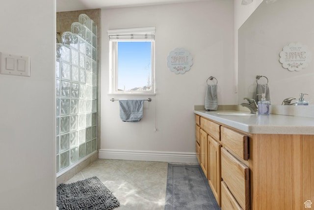 13053 S 1300 W, Riverton, UT 84065 - bathroom featuring vanity, walk in shower, tile patterned flooring, and baseboards