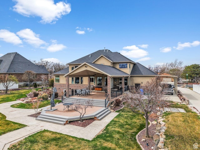 13053 S 1300 W, Riverton, UT 84065 - rear view of property with a ceiling fan, a deck, a lawn, and stucco siding