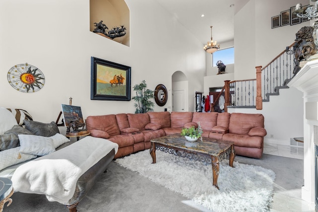 13053 S 1300 W, Riverton, UT 84065 - living room with arched walkways, high vaulted ceiling, a chandelier, and stairs