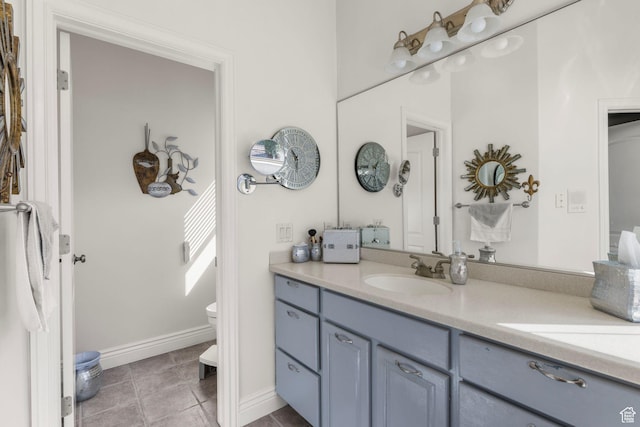 13053 S 1300 W, Riverton, UT 84065 - full bath with double vanity, toilet, tile patterned flooring, and baseboards