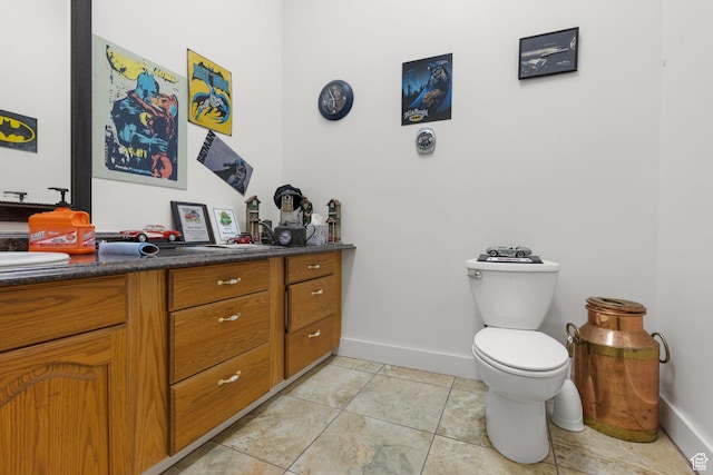 13053 S 1300 W, Riverton, UT 84065 - bathroom with vanity, baseboards, toilet, and tile patterned flooring