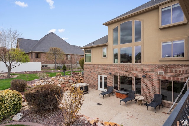 13053 S 1300 W, Riverton, UT 84065 - back of property with a patio area, brick siding, and stucco siding