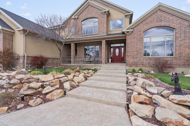 13053 S 1300 W, Riverton, UT 84065 - property entrance featuring brick siding and covered porch