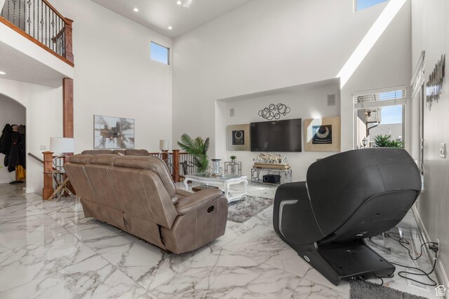 13053 S 1300 W, Riverton, UT 84065 - living area featuring a towering ceiling, marble finish flooring, recessed lighting, and arched walkways