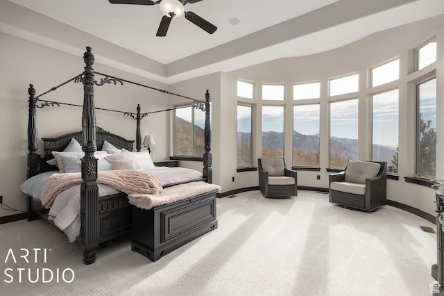 5055 Waterfall Dr, Pleasant View, UT 84414 - bedroom featuring a ceiling fan, baseboards, a mountain view, and light colored carpet