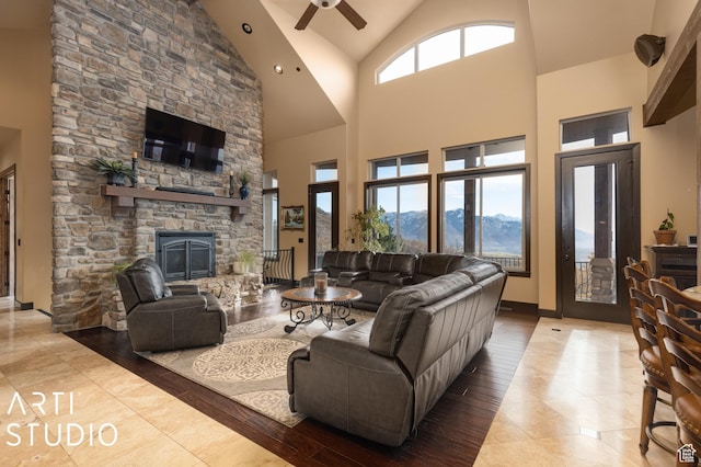 5055 Waterfall Dr, Pleasant View, UT 84414 - living room featuring baseboards, a fireplace, ceiling fan, and plenty of natural light