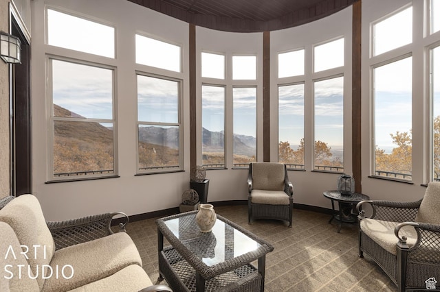 5055 Waterfall Dr, Pleasant View, UT 84414 - sunroom featuring a healthy amount of sunlight, a towering ceiling, baseboards, and a mountain view