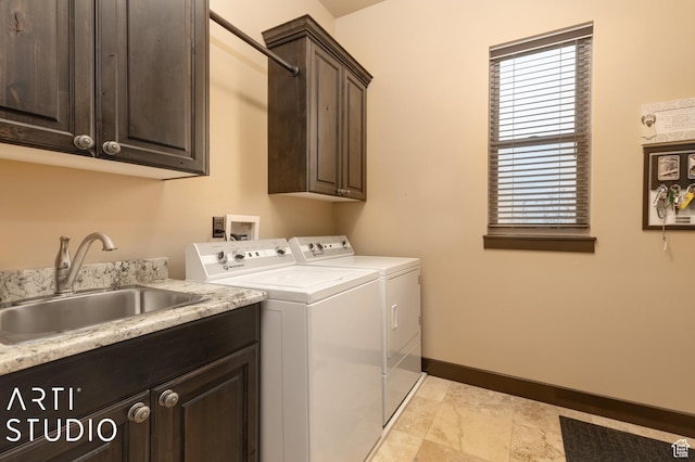 5055 Waterfall Dr, Pleasant View, UT 84414 - laundry area featuring a sink, cabinet space, baseboards, and separate washer and dryer