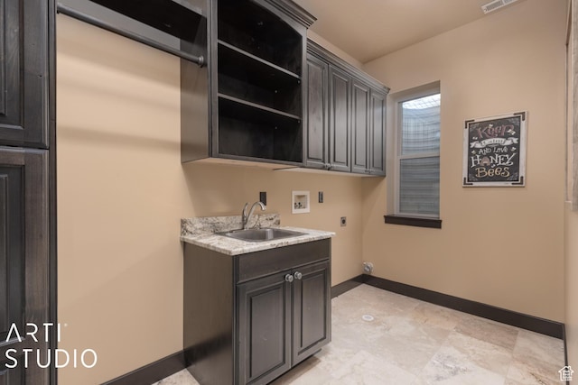 5055 Waterfall Dr, Pleasant View, UT 84414 - clothes washing area with baseboards, a sink, cabinet space, electric dryer hookup, and washer hookup