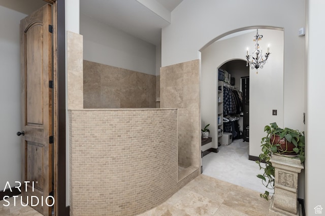5055 Waterfall Dr, Pleasant View, UT 84414 - corridor with a notable chandelier and arched walkways