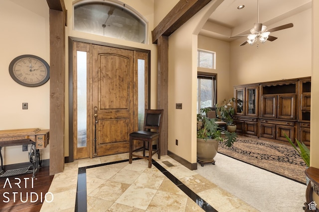 5055 Waterfall Dr, Pleasant View, UT 84414 - foyer entrance with baseboards, a high ceiling, arched walkways, and ceiling fan