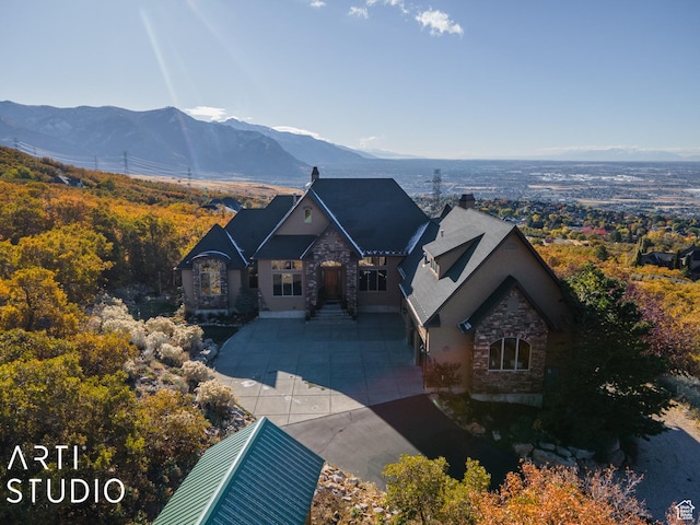 5055 Waterfall Dr, Pleasant View, UT 84414 - french country home with stone siding and a mountain view