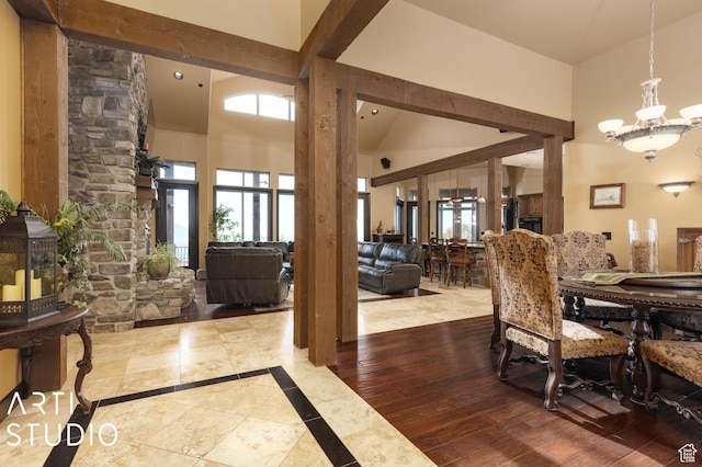 5055 Waterfall Dr, Pleasant View, UT 84414 - dining room with a high ceiling, a chandelier, and wood finished floors