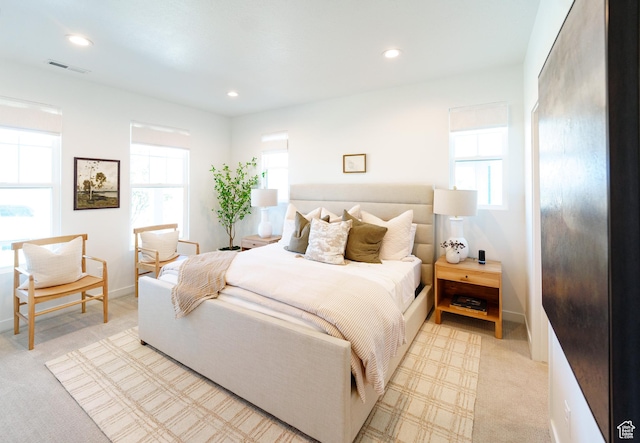 bedroom with visible vents, recessed lighting, and multiple windows