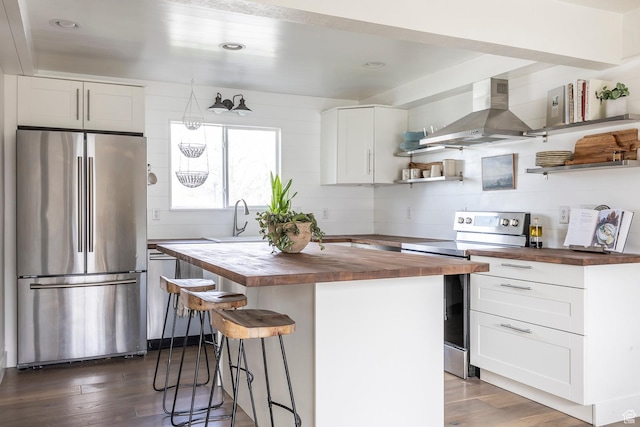1468 S 100 W, Orem, UT 84058 - kitchen with open shelves, wall chimney exhaust hood, a center island, butcher block counters, and stainless steel appliances