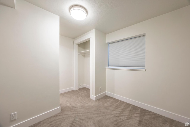1468 S 100 W, Orem, UT 84058 - unfurnished bedroom with baseboards, carpet floors, a textured ceiling, and a closet