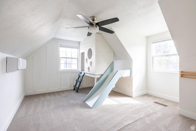 1468 S 100 W, Orem, UT 84058 - additional living space with a textured ceiling, visible vents, a ceiling fan, and carpet
