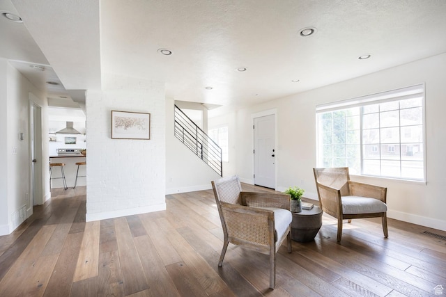 1468 S 100 W, Orem, UT 84058 - living area with baseboards, visible vents, stairway, and hardwood / wood-style flooring