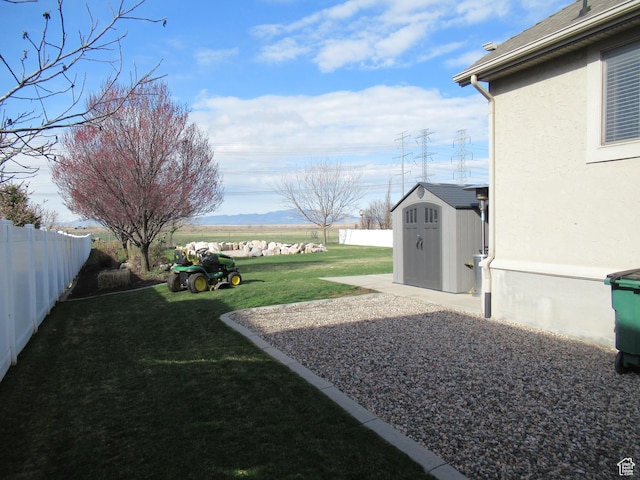 760 S Wellington Dr W, Kaysville, UT 84037 - view of yard with a fenced backyard, an outbuilding, and a shed
