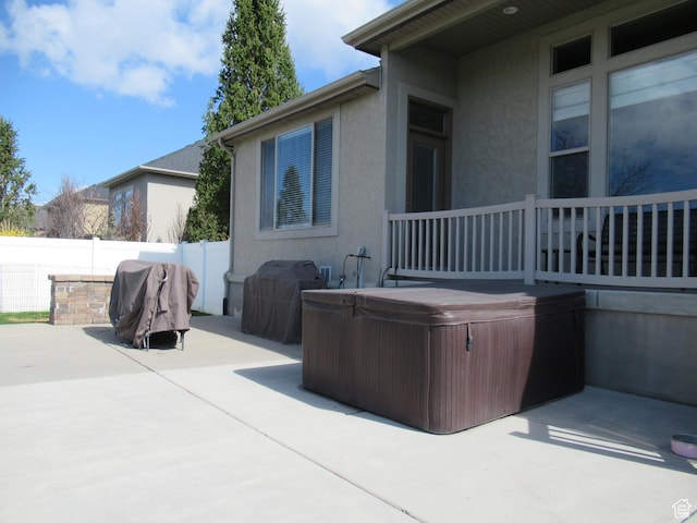 760 S Wellington Dr W, Kaysville, UT 84037 - view of patio / terrace featuring a hot tub, fence, and grilling area