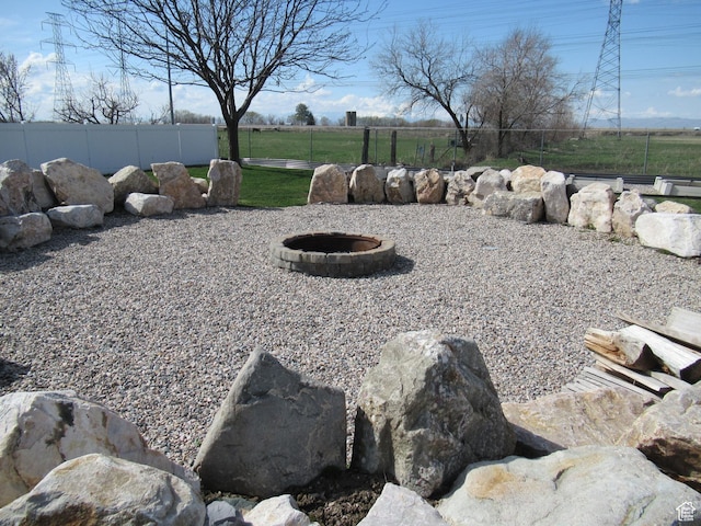 760 S Wellington Dr W, Kaysville, UT 84037 - view of yard with an outdoor fire pit and fence