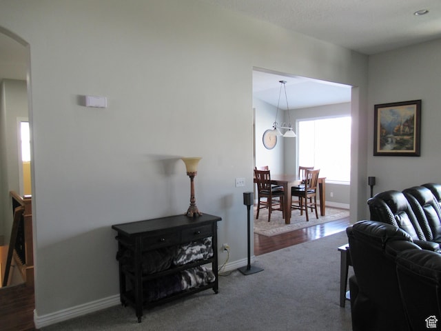 760 S Wellington Dr W, Kaysville, UT 84037 - living room with carpet floors, arched walkways, and baseboards