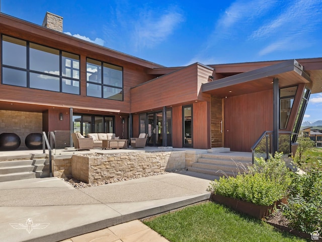 6639 E Chaparral Rd, Huntsville, UT 84317 - exterior space with an outdoor hangout area, a chimney, and a patio area