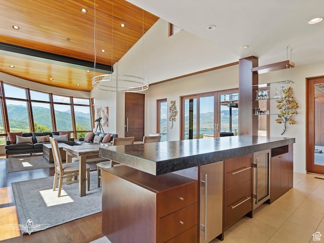 6639 E Chaparral Rd, Huntsville, UT 84317 - kitchen featuring a mountain view, dark countertops, wooden ceiling, and plenty of natural light