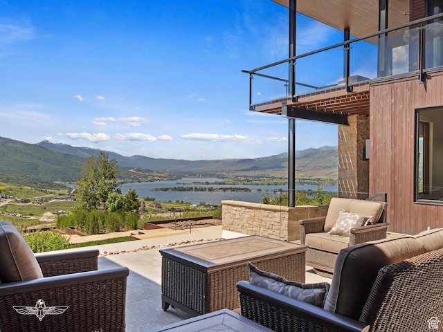 6639 E Chaparral Rd, Huntsville, UT 84317 - view of patio featuring outdoor lounge area, a balcony, and a water and mountain view
