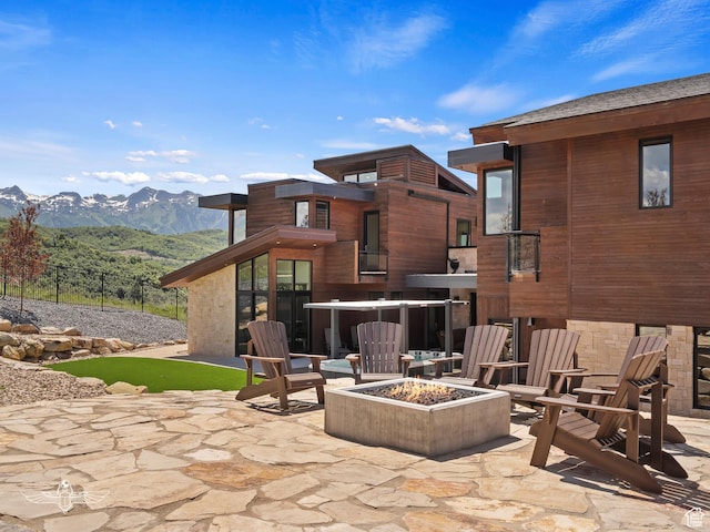 6639 E Chaparral Rd, Huntsville, UT 84317 - view of patio with an outdoor fire pit and a mountain view