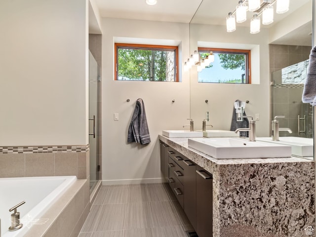 6639 E Chaparral Rd, Huntsville, UT 84317 - full bathroom with double vanity, a sink, a stall shower, and a bath
