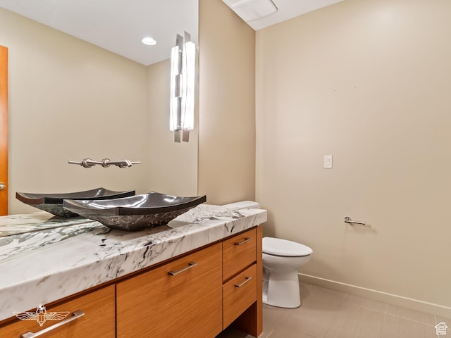 6639 E Chaparral Rd, Huntsville, UT 84317 - bathroom with baseboards, toilet, recessed lighting, vanity, and tile patterned flooring