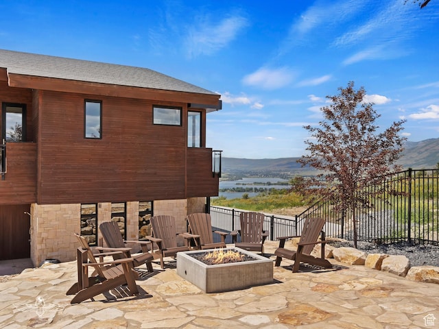 6639 E Chaparral Rd, Huntsville, UT 84317 - view of patio / terrace with a fire pit, fence, and a mountain view