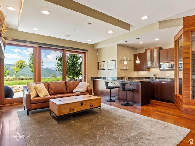 6639 E Chaparral Rd, Huntsville, UT 84317 - living room featuring recessed lighting, wet bar, and dark wood-type flooring