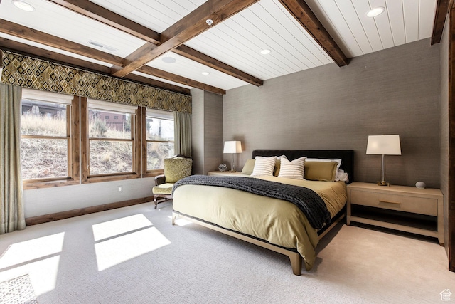 carpeted bedroom featuring beamed ceiling, wallpapered walls, visible vents, and recessed lighting