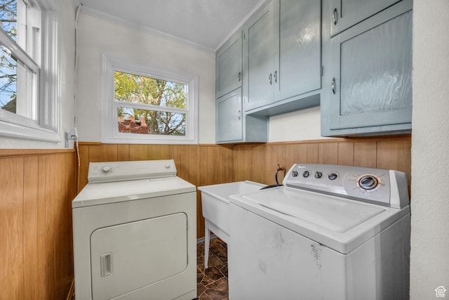 410 N 175 E, North Salt Lake, UT 84054 - laundry room featuring ornamental molding, wooden walls, cabinet space, washing machine and dryer, and wainscoting